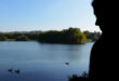 Woman beside a lake